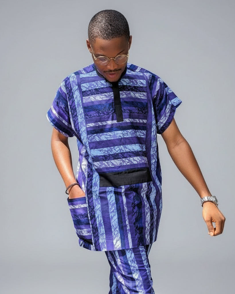 Person wearing a blue and purple striped outfit on a gray background