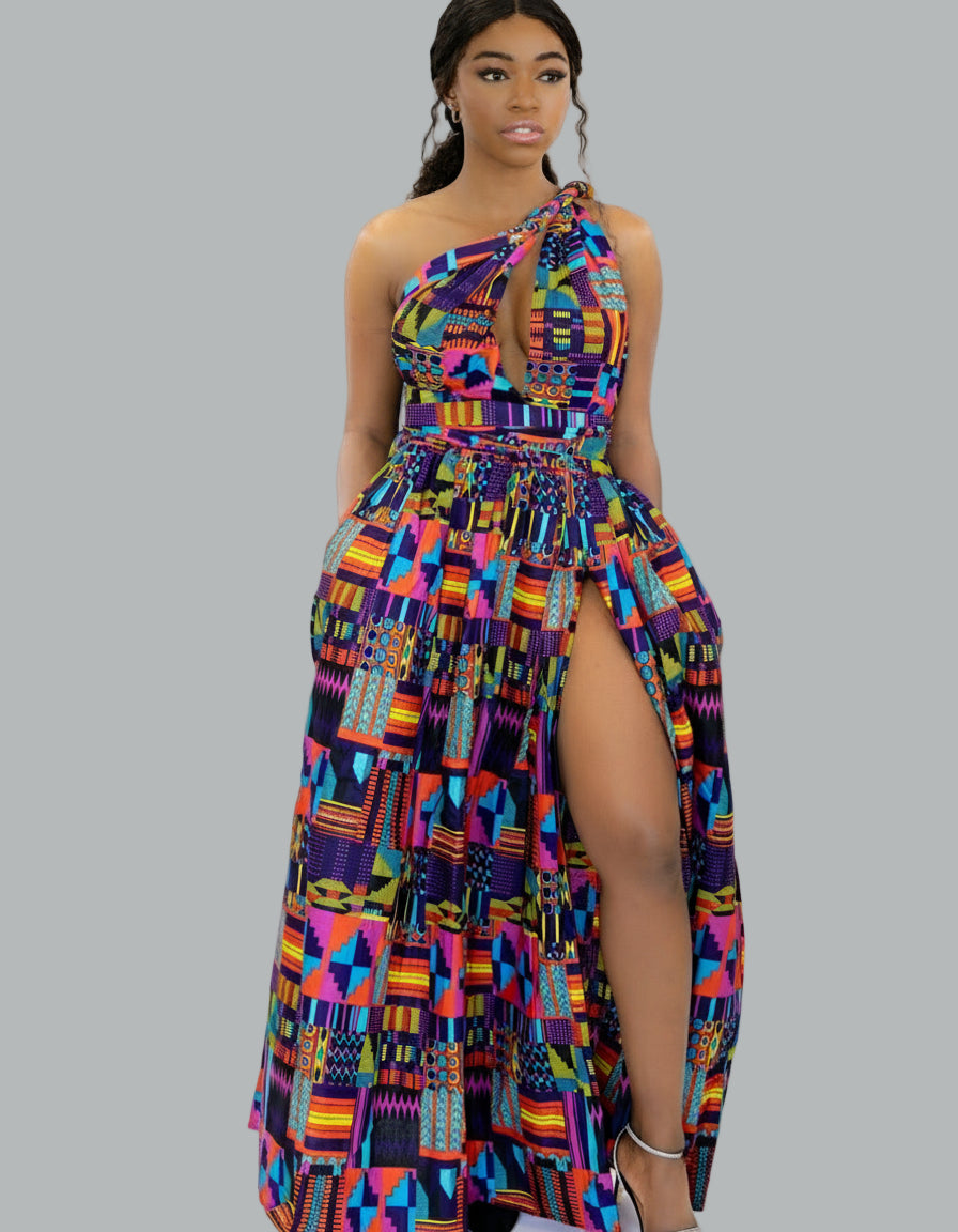 Woman wearing a colorful patterned dress on a grey background